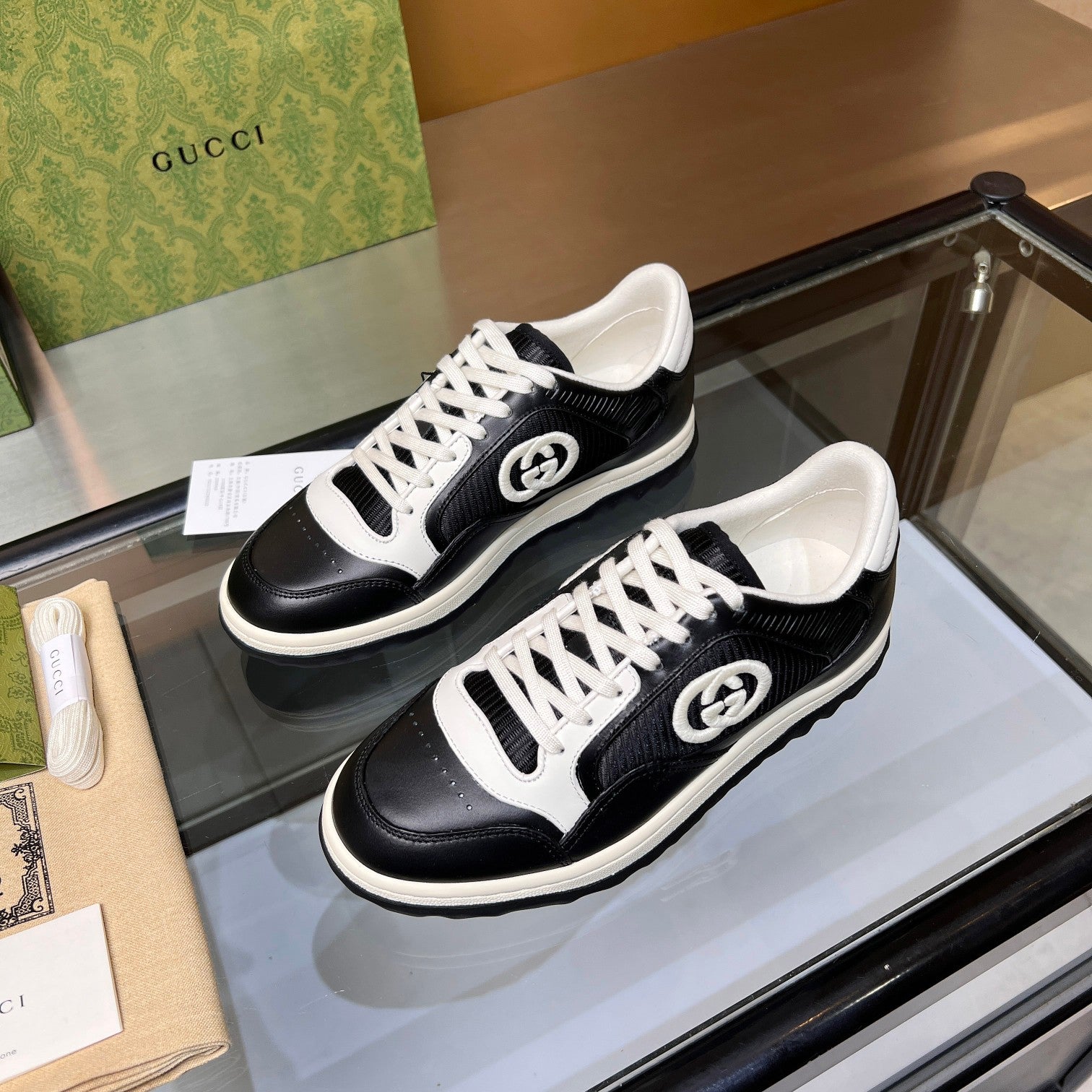 Gucci GG Interlocking Sneakers - Black & White Leather Low-Top