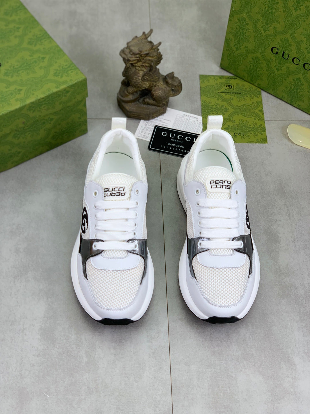 Gucci White Leather Sneakers with Gold Trim and Web Stripe
