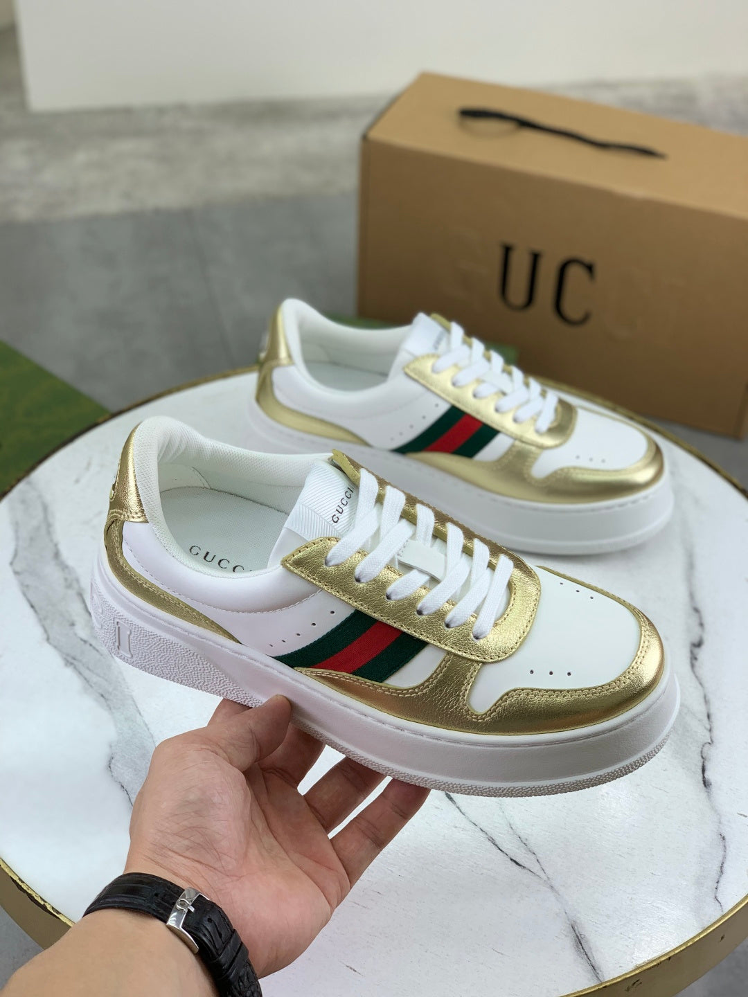 Gucci White Leather Sneakers with Gold Trim and Web Stripe