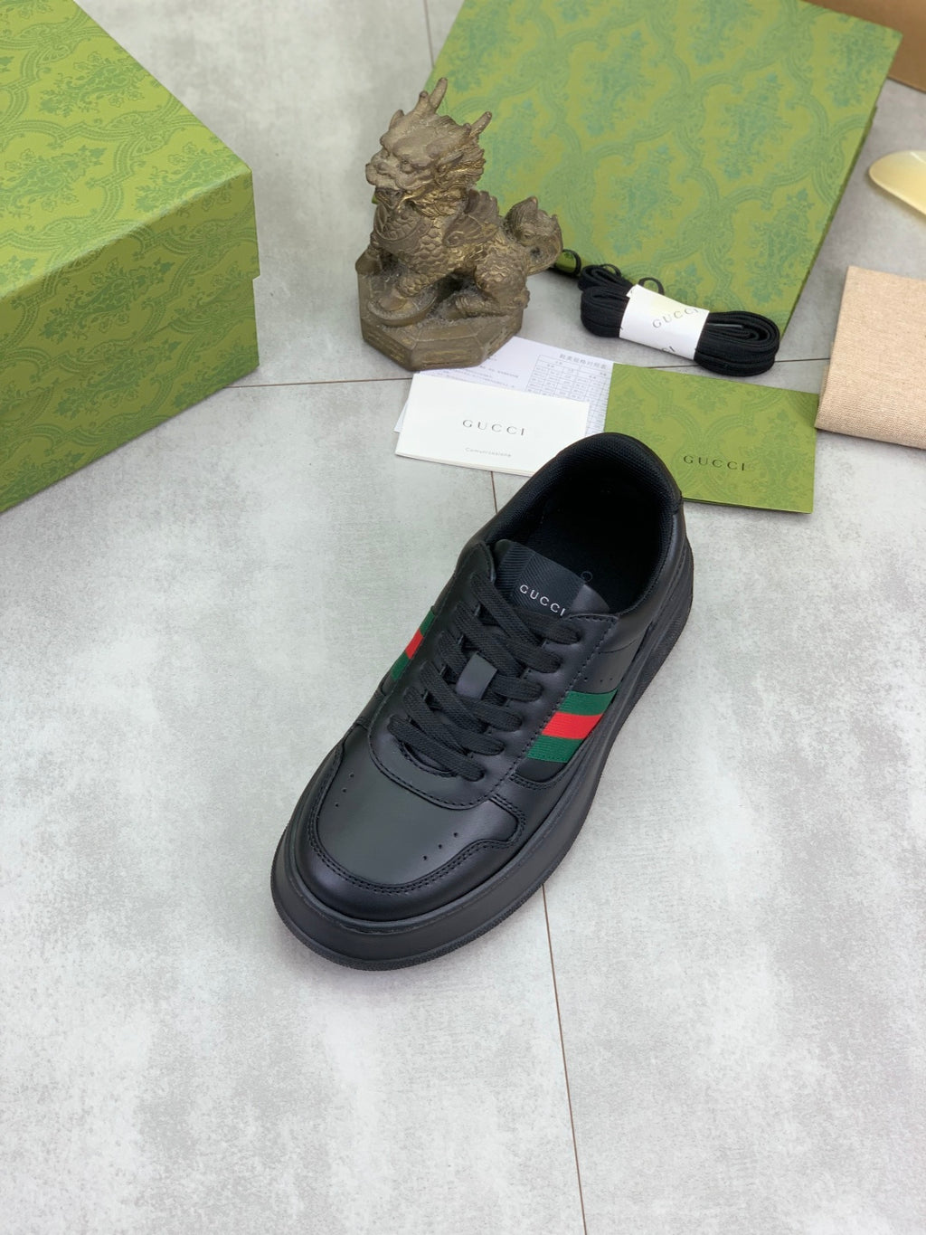 Gucci All-Black Leather Sneakers with Web Stripe